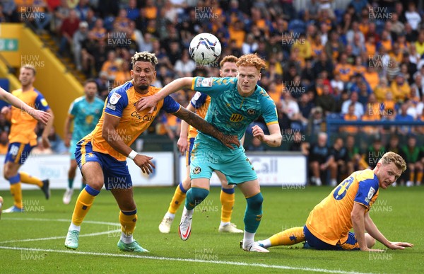 140821 - Mansfield Town v Newport County - EFL SkyBet League 2 - Ryan Haynes of Newport County is tackled by Kellan Gordon of Mansfield Town