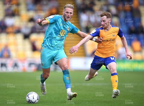 140821 - Mansfield Town v Newport County - EFL SkyBet League 2 - Cameron Norman of Newport County is tackled by Stephen Quinn of Mansfield Town