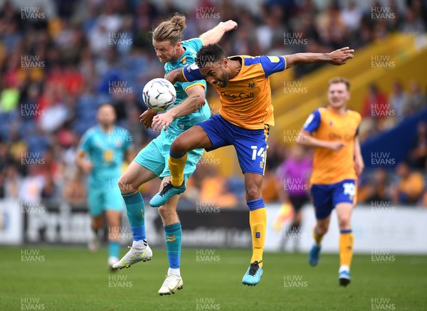 140821 - Mansfield Town v Newport County - EFL SkyBet League 2 - Alex Fisher of Newport County and James Perch of Mansfield Town compete
