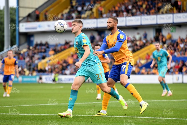 140821 - Mansfield Town v Newport County - EFL SkyBet League 2 - Lewis Collins of Newport County is tackled ny Jordan Bowery of Mansfield Town
