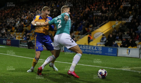 251022 - Mansfield Town v Newport County - Sky Bet League 2 - Cameron Norman of Newport County tries to escape from George Maris of Mansfield Town