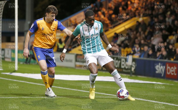 251022 - Mansfield Town v Newport County - Sky Bet League 2 - Omar Bogle of Newport County and Kieran Wallace of Mansfield Town