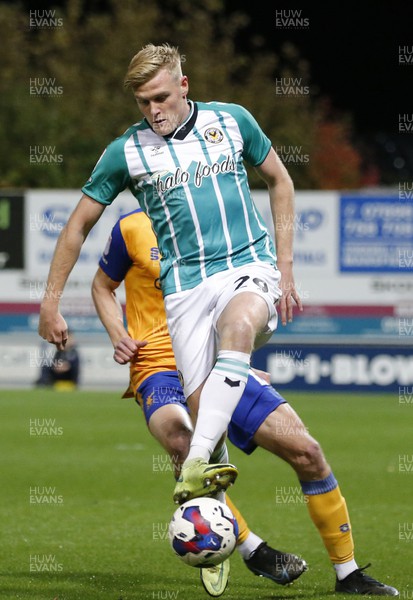 251022 - Mansfield Town v Newport County - Sky Bet League 2 - Will Evans of Newport County and Oliver Hawkins of Mansfield Town