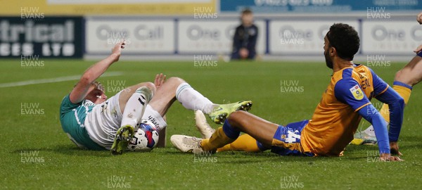 251022 - Mansfield Town v Newport County - Sky Bet League 2 - Will Evans of Newport County loses the ball to Elliott Hewitt of Mansfield Town