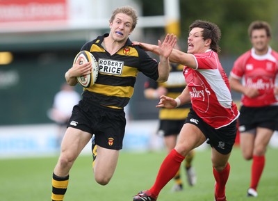 02.08.08 -  Newport v Cross Keys, Men of Gwent 7's FINAL, Rodney Parade- Newport's Yom Isaacs breaks away from Cross Keys James Ledbetter 