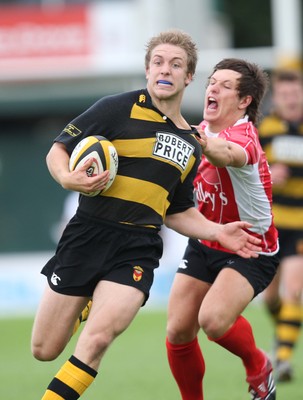 02.08.08 -  Newport v Cross Keys, Men of Gwent 7's FINAL, Rodney Parade- Newport's Yom Isaacs breaks away from Cross Keys James Ledbetter 