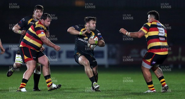 150317 - Merthyr RFC v Carmarthen Quins - Foster's Cup Semi Final - Aaron Pincers of Merthyr is challenged by Javan Sebastian of Carmarthen