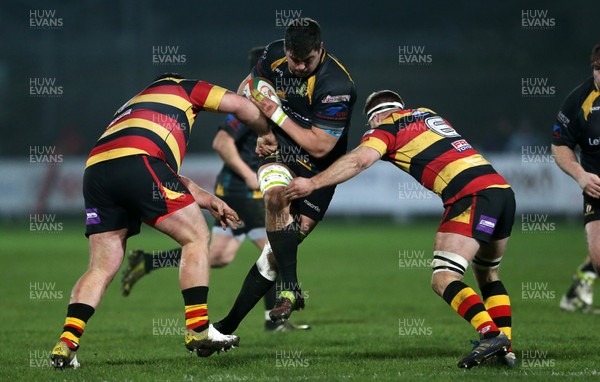 150317 - Merthyr RFC v Carmarthen Quins - Foster's Cup Semi Final - Nick White of Merthyr is tackled by Nathan Williams and Elis Huw Lloyd of Carmarthen