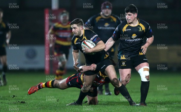 150317 - Merthyr RFC v Carmarthen Quins - Foster's Cup Semi Final - Jake Crocket of Merthyr is tackled by Morgan Griffiths of Carmarthen