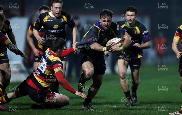 150317 - Merthyr RFC v Carmarthen Quins - Foster's Cup Semi Final - Aaron Pincers of Merthyr is tackled by Iolo Wyn Evans of Carmarthen