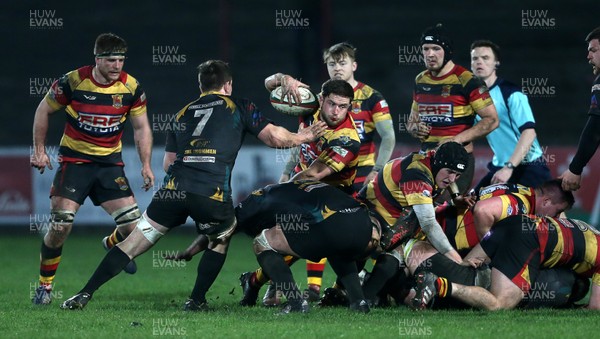 150317 - Merthyr RFC v Carmarthen Quins - Foster's Cup Semi Final - Rhodri Brendon Clancy of Carmarthen is tackled by Sam Evans of Merthyr