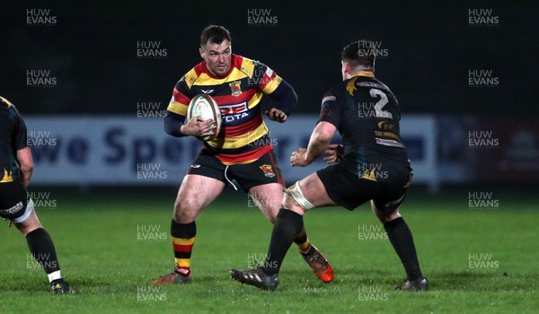 150317 - Merthyr RFC v Carmarthen Quins - Foster's Cup Semi Final - John Rhys Williams of Carmarthen is tackled by Sam Evans of Merthyr