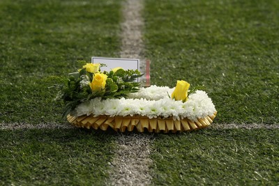 101026 - Merthyr v Beddau - Admiral WRU Premiership - Players of Merthyr and Beddau pay their respects to those lost at Aberfan 60 years ago before kick off 