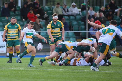 101026 - Merthyr v Beddau - Admiral WRU Premiership - James Soanes of Merthyr box kicks 