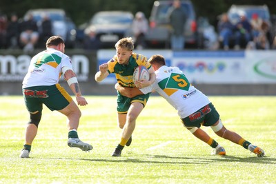 101026 - Merthyr v Beddau - Admiral WRU Premiership - Adam Ashford of Beddau is tackled by Paddy McBride of Merthyr