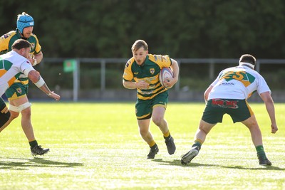 101026 - Merthyr v Beddau - Admiral WRU Premiership - Adam Ashford of Beddau looks for a gap between Travis Hawkins(L) and Jack Perkins of Merthyr