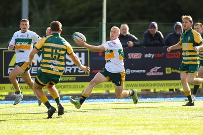 101026 - Merthyr v Beddau - Admiral WRU Premiership - Cole Swannack of Merthyr claims a bouncing ball ahead of Ollie Wilde of Beddau