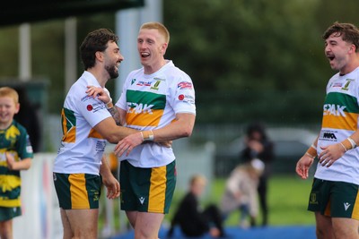 101026 - Merthyr v Beddau - Admiral WRU Premiership - Cole Swannack of Merthyr celebrates his try with team mates