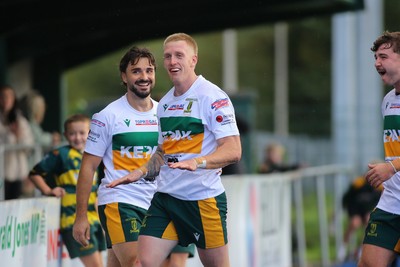 101026 - Merthyr v Beddau - Admiral WRU Premiership - Cole Swannack of Merthyr celebrates his try with team mates