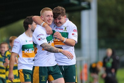 101026 - Merthyr v Beddau - Admiral WRU Premiership - Cole Swannack of Merthyr celebrates his try with team mates