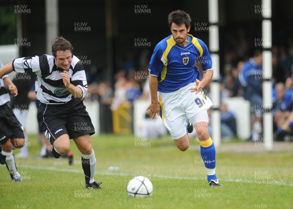 12.07.08 - Pre season Friendly Merthyr Tydfil v Cardiff City XI Cardiff's Steve Thompson tries to beat Merthyr's Steve Williams 