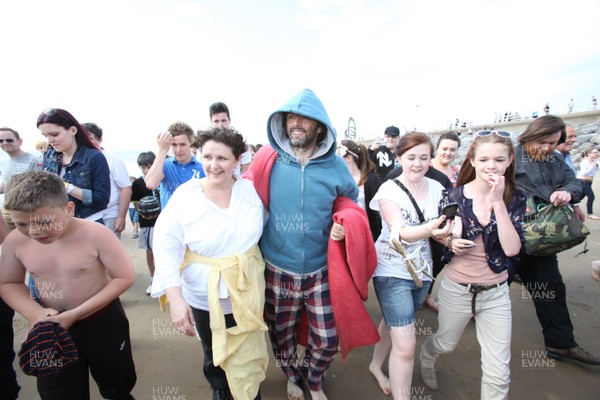 22.04.11 - The Passion with Michael Sheen, Aberavon Beach, south Wales. Michael Sheen playing the part of The Schoolteacher during his performance in The Passion on Aberavon Beach, south Wales 