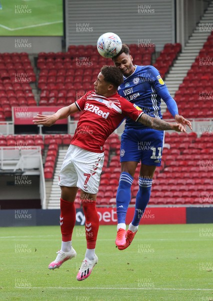 180720 - Middlesbrough v Cardiff City - Sky Bet Championship -  Josh Murphy of Cardiff City (R) goes up for a header with Marcus Tavernier  of Middlesbrough