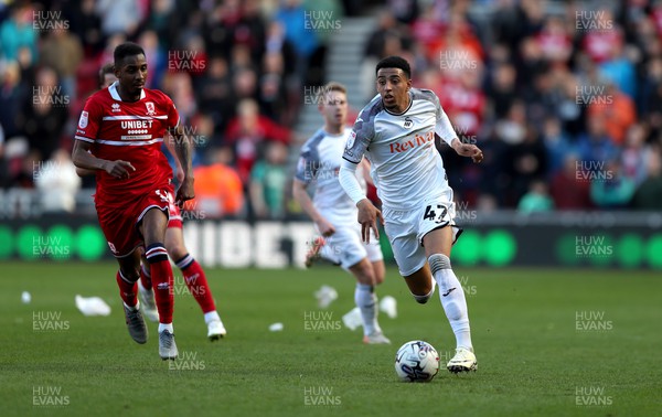 060424 - Middlesbrough v Swansea City - Sky Bet Championship - Isaiah Jones of Middlesbrough and Azeem Abdulai of Swansea City