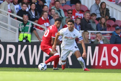 090825 - Middlesbrough v Swansea City - Sky Bet Championship - Swansea City's Ben Cabango in action with Middlesbrough's Delano Burgzorg 