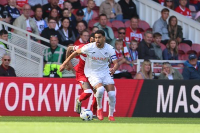 090825 - Middlesbrough v Swansea City - Sky Bet Championship - Swansea City's Ben Cabango in action with Middlesbrough's Delano Burgzorg 