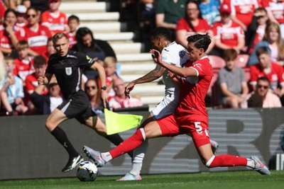 090825 - Middlesbrough v Swansea City - Sky Bet Championship - Middlesbrough's Alfie Jones battles for possession with Swansea City's Ronald