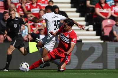 090825 - Middlesbrough v Swansea City - Sky Bet Championship - Middlesbrough's Alfie Jones battles for possession with Swansea City's Ronald
