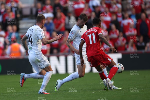 090825 - Middlesbrough v Swansea City - Sky Bet Championship - Swansea City's Cameron Burgess and Josh Tymon put pressure on Middlesbrough's Morgan Whittaker