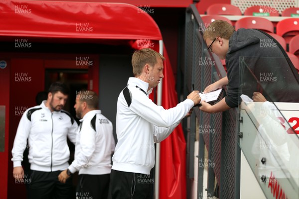 220918 - Middlesbrough v Swansea City - SkyBet Championship - Swansea City manager Graham Potter signs an autograph before kick off