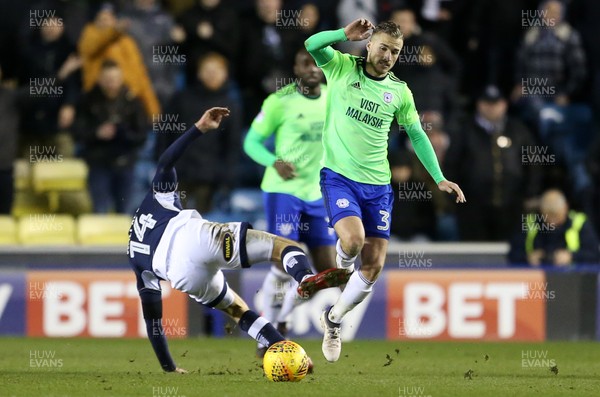 090218 - Millwall v Cardiff City - SkyBet Championship - Joe Bennett of Cardiff City is tackled by Jed Wallace of Millwall