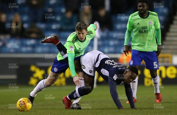 090218 - Millwall v Cardiff City - SkyBet Championship - Fred Onyedinma of Millwall is tackled by Greg Halford of Cardiff City