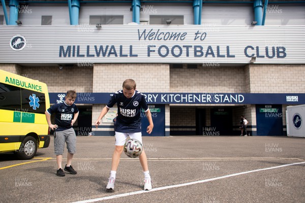 030922 - Millwall v Cardiff City - Sky Bet Championship - Millwall fan plays with ball outside the Barry Kitchener Stand at The Den