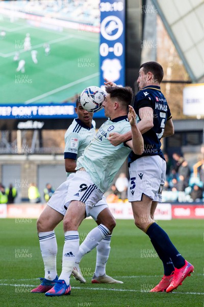 120222 - Millwall v Cardiff City - Sky Bet Championship - Jordan Hugill of Cardiff City and Murray Wallace of Millwall battle for the ball