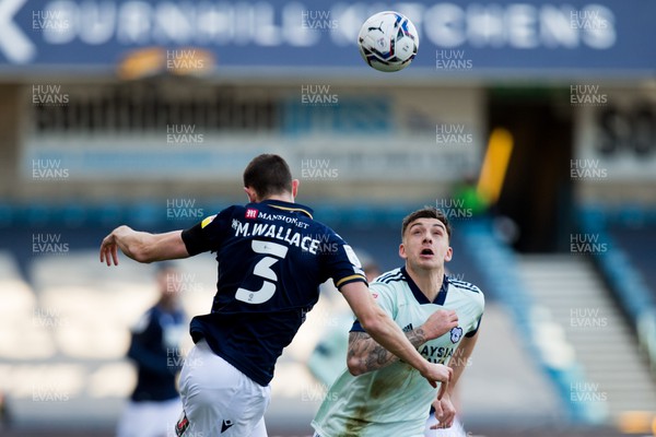 120222 - Millwall v Cardiff City - Sky Bet Championship - Murray Wallace of Millwall heads the ball