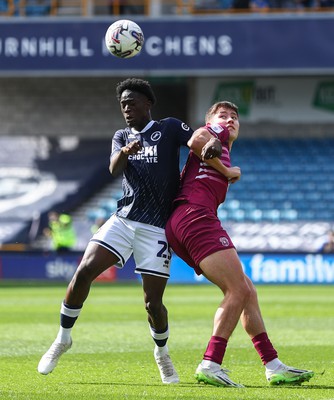 130424 - Millwall v Cardiff City - Sky Bet Championship - Romain Esse of Millwall battles with Rubin Colwill of Cardiff City