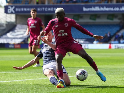 130424 - Millwall v Cardiff City - Sky Bet Championship - Jamilu Collins of Cardiff City is tackled by George Saville of Millwall