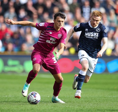 130424 - Millwall v Cardiff City - Sky Bet Championship - Perry Ng of Cardiff City is pressured by Duncan Watmore of Millwall