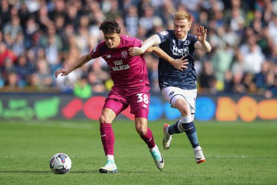 130424 - Millwall v Cardiff City - Sky Bet Championship - Perry Ng of Cardiff City battles with Duncan Watmore of Millwall