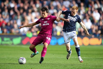 130424 - Millwall v Cardiff City - Sky Bet Championship - Perry Ng of Cardiff City battles with Duncan Watmore of Millwall