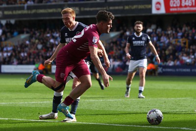 130424 - Millwall v Cardiff City - Sky Bet Championship - Ollie Tanner of Cardiff City runs at Duncan Watmore of Millwall