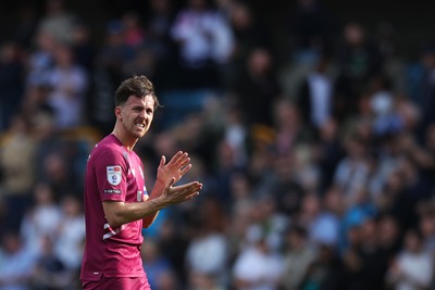 130424 - Millwall v Cardiff City - Sky Bet Championship - Ryan Wintle of Cardiff City applauds fans after the full-time whistle