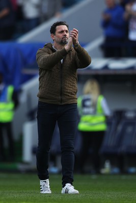 130424 - Millwall v Cardiff City - Sky Bet Championship - Erol Bulut, Manager of Cardiff City applauds fans after the full-time whistle