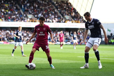 130424 - Millwall v Cardiff City - Sky Bet Championship - Perry Ng of Cardiff City is pressured by Jake Cooper of Millwall