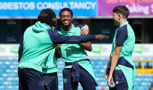 130424 - Millwall v Cardiff City - Sky Bet Championship - Raheem Conte of Cardiff City smiles and jokes with team mates before kick-off