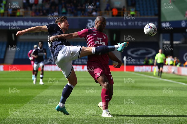 130424 - Millwall v Cardiff City - Sky Bet Championship - Yakou Meite of Cardiff City is challenged by Ryan Leonard of Millwall